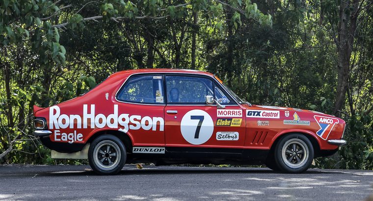 A red Holden Torana GTR XU-1 in Ron Hodgson Motors racing livery, number 7